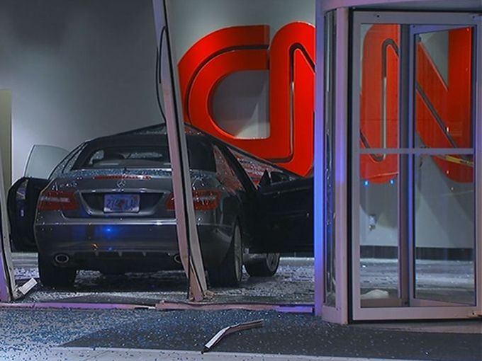 Car crashes into CNN Center