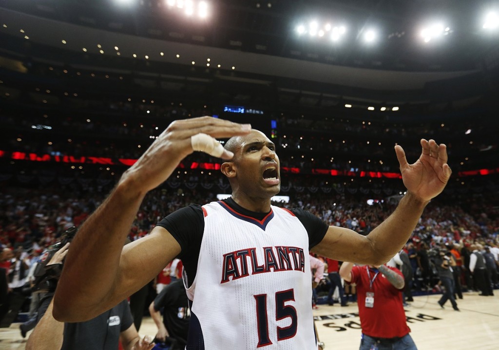 Atlanta Hawks' Al Horford celebrates after the Hawks beat the Washington Wizards 82-81 in Game 5 of the second round of the NBA basketball playoffs Wednesday, May 13, 2015, in Atlanta. (AP Photo/John Bazemore)