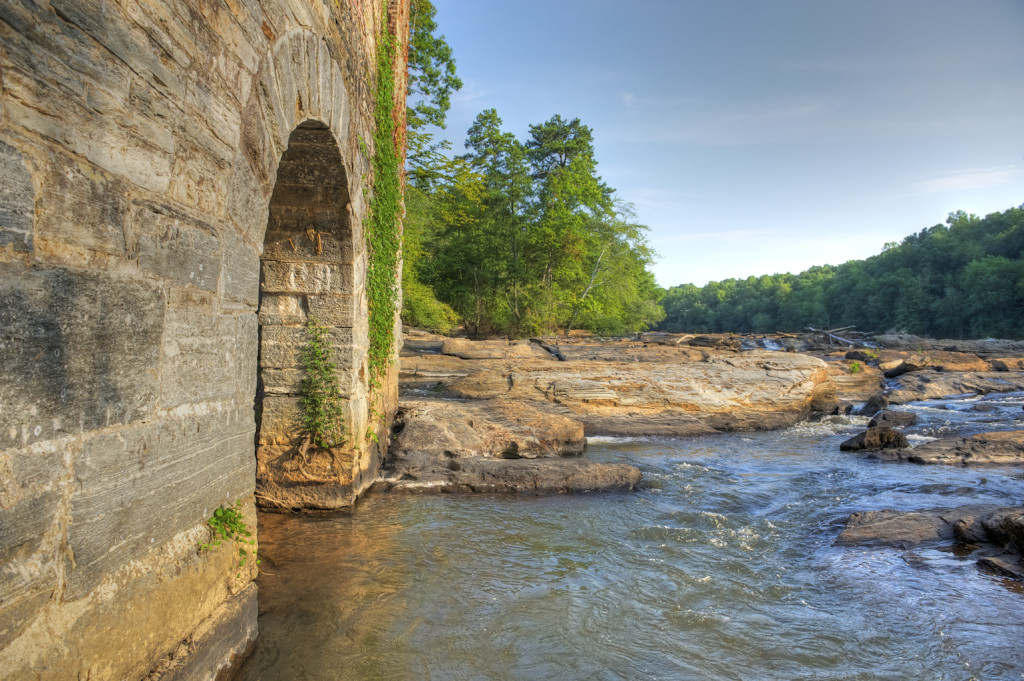 An arch in the ruins of the New Manchester Factory and Sweetwater Creek near Lithia Springs, Georgia