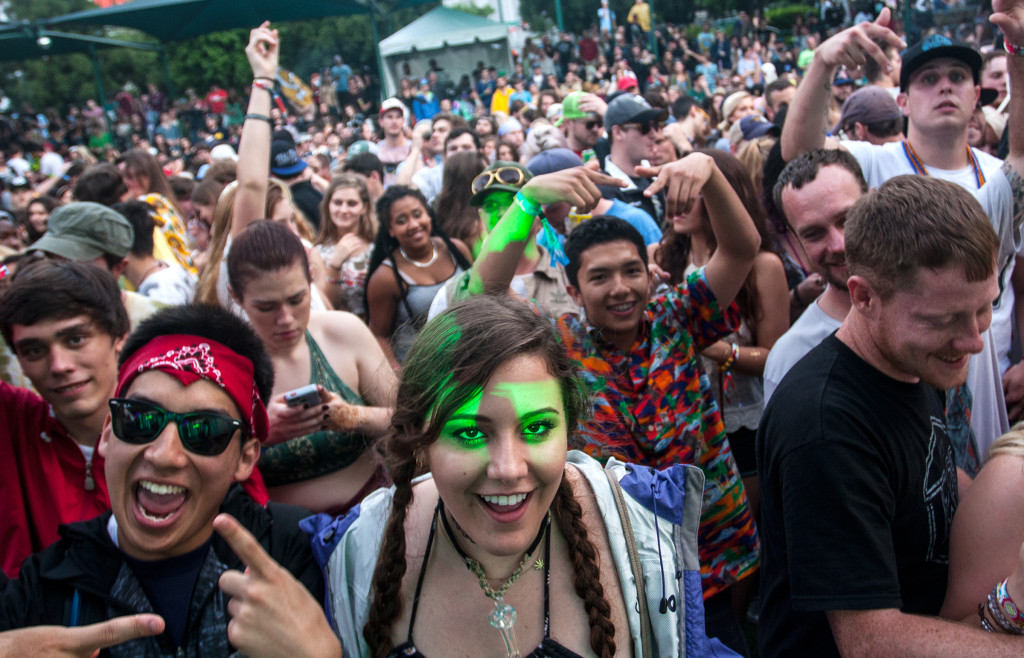 Festival attendees enjoy music from the DJ stage at the SweetWater 420 Fest in downtown Atlanta, Ga., on Saturday, April 18, 2015. April showers left the festival grounds ankle-deep in mud, but the event still drew more than 20,000 people on Staurday. (AP Photo/ Ron Harris)