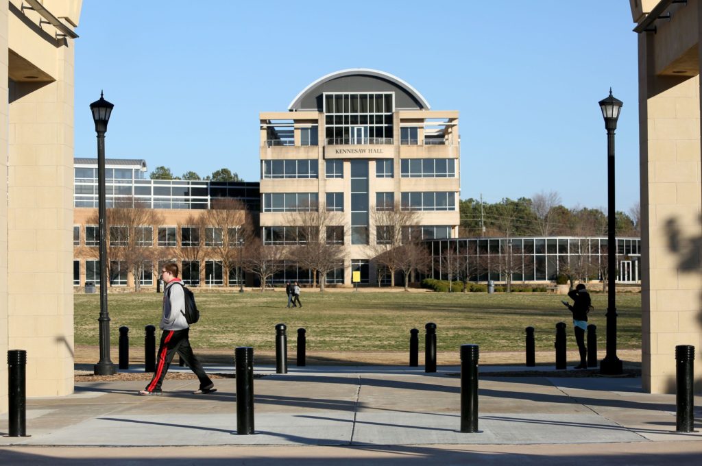 January 30, 2015 - Kennesaw, Ga: Kennesaw State University students walk on the KSU campus as Kennesaw Hall is shown in the background Friday afternoon, January 30, 2015, in Kennesaw, Ga.. PHOTO / JASON GETZ