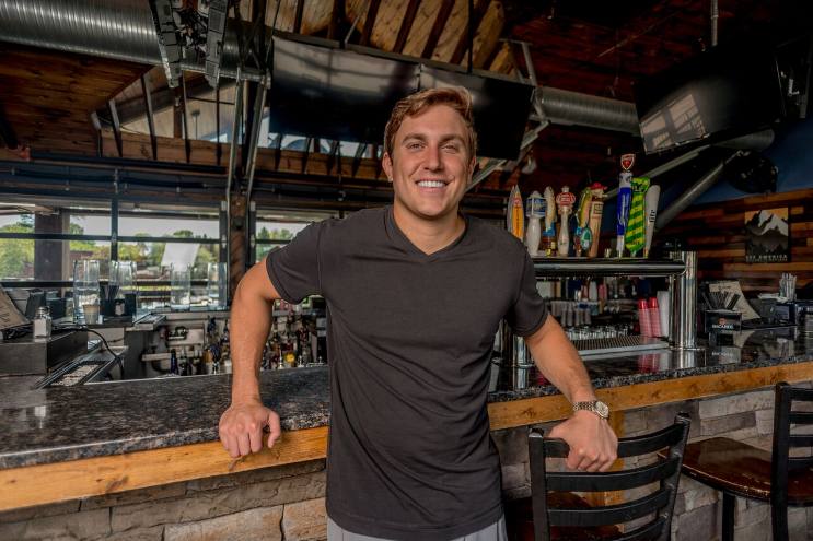 Evan Rosenberg at one of his co-owned bars, Big Sky Buckhead; Photo credit: Ian