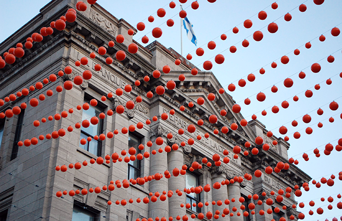 Rainbow-colored balls hung over the pedestrian street in the Gay Village in Montreal near the Auberge Le Pomerol