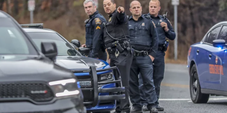 3 Activists Arrested and Charged with Felonies for Distributing Flyers with Names of Officers Involved in Forest Defender’s Killing