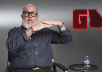 Interview guest seated in the GAFollowers studio beside a red Georgia-shaped logo.