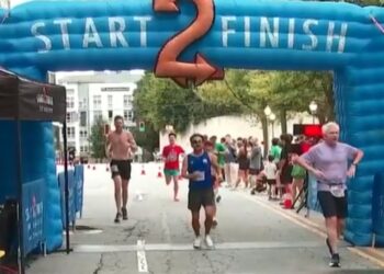 Runners crossing the finish line during Atlanta’s Big Peach Sizzler on Labor Day 2026.