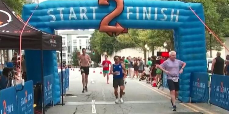 Runners crossing the finish line during Atlanta’s Big Peach Sizzler on Labor Day 2026.