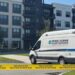 Police crime scene vehicles outside a Buford apartment complex