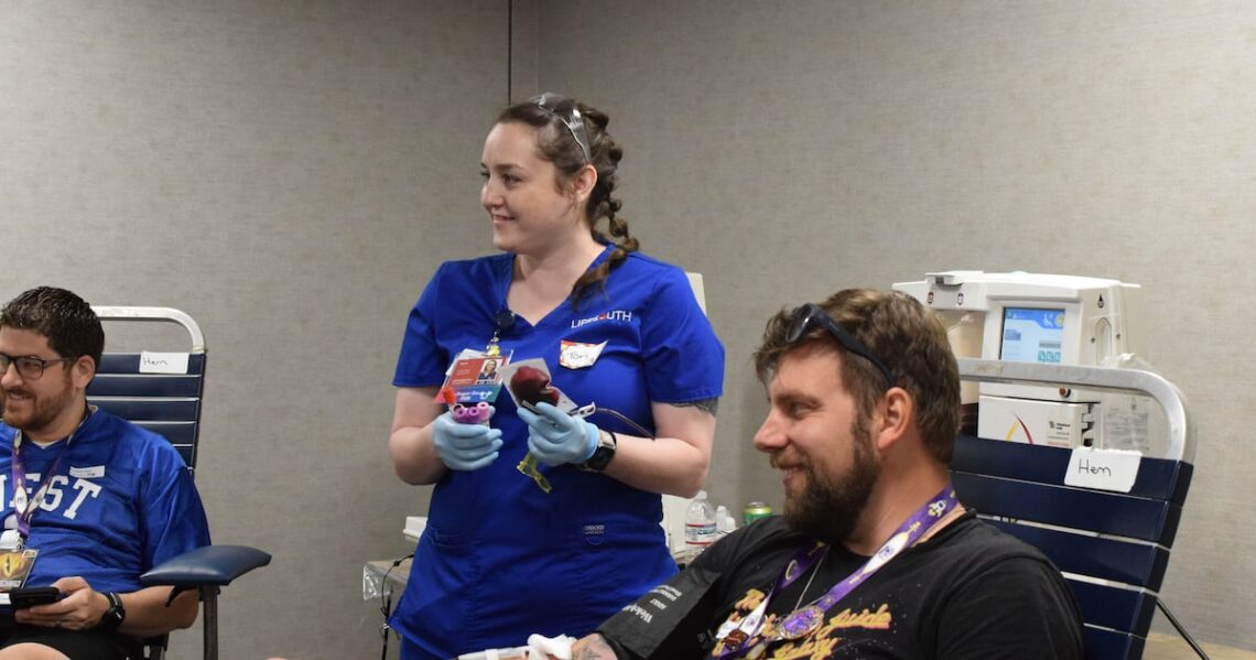 A Dragon Con attendee donating blood during the 2026 LifeSouth blood drive in Atlanta; Sam Sachs/WSB-TV photo.