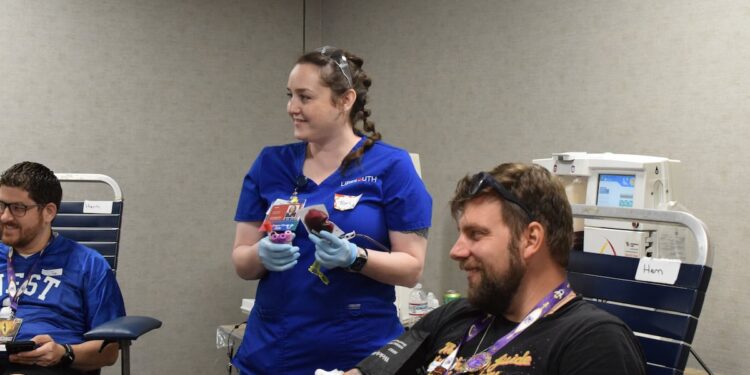 A Dragon Con attendee donating blood during the 2026 LifeSouth blood drive in Atlanta; Sam Sachs/WSB-TV photo.