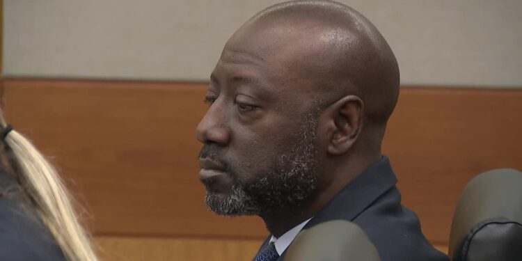 Former East Point police officer Richard Gooddine seated in a Fulton County courtroom during his 2026 retrial.