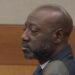 Former East Point police officer Richard Gooddine seated in a Fulton County courtroom during his 2026 retrial.