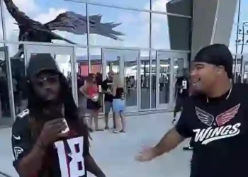 Jalen of @wings.atl interviewing an Atlanta Falcons fan during GAFollowers game-day coverage.
