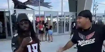 Jalen of @wings.atl interviewing an Atlanta Falcons fan during GAFollowers game-day coverage.