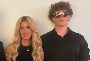 Kim Zolciak standing beside her son Kroy Biermann Jr.