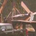 Damaged single-engine airplane being removed after a crash in Paulding County