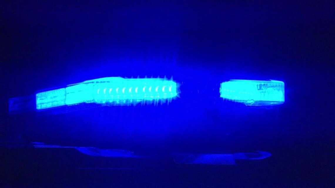 Blue police lights illuminated at night
