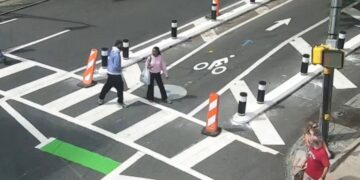 Atlanta Police Department surveillance footage showing a suspect confronting a woman near 10th and West Peachtree streets in Midtown Atlanta on Oct. 3, 2026.