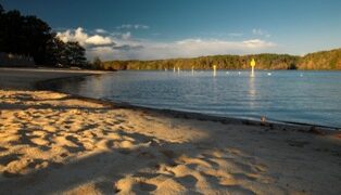 Sandy beach and roped swimming area at Lake Chapman in Sandy Creek Park, Athens, Georgia.